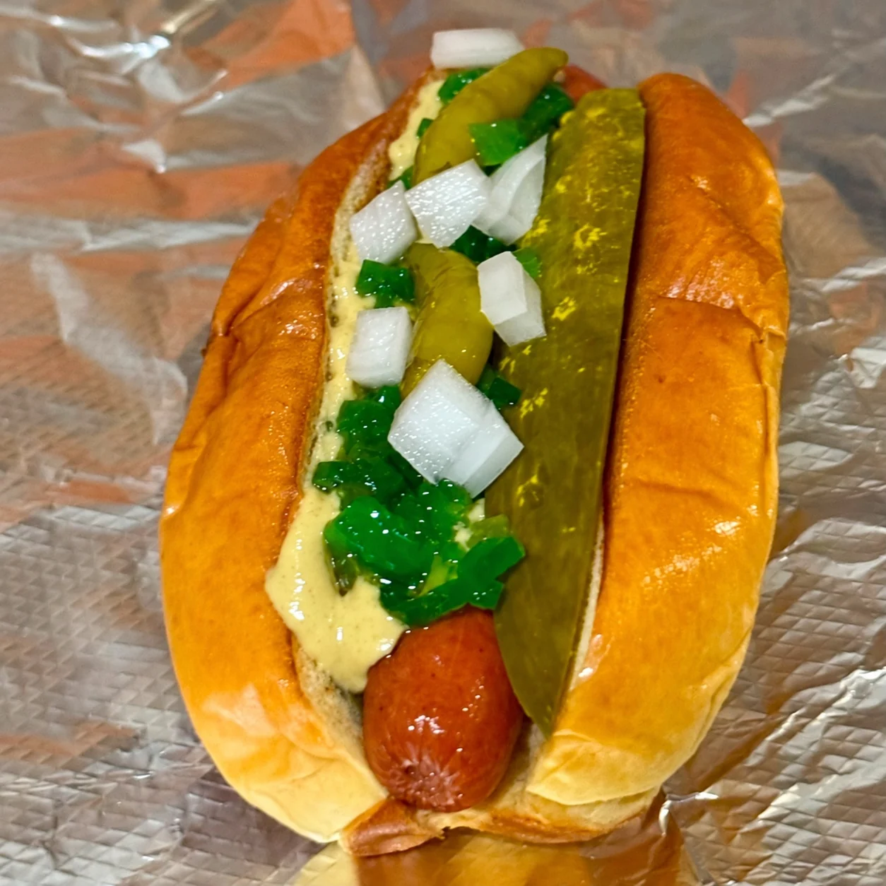 Actual Chicago Dog with mustard, relish, onions, pickle and sport peppers