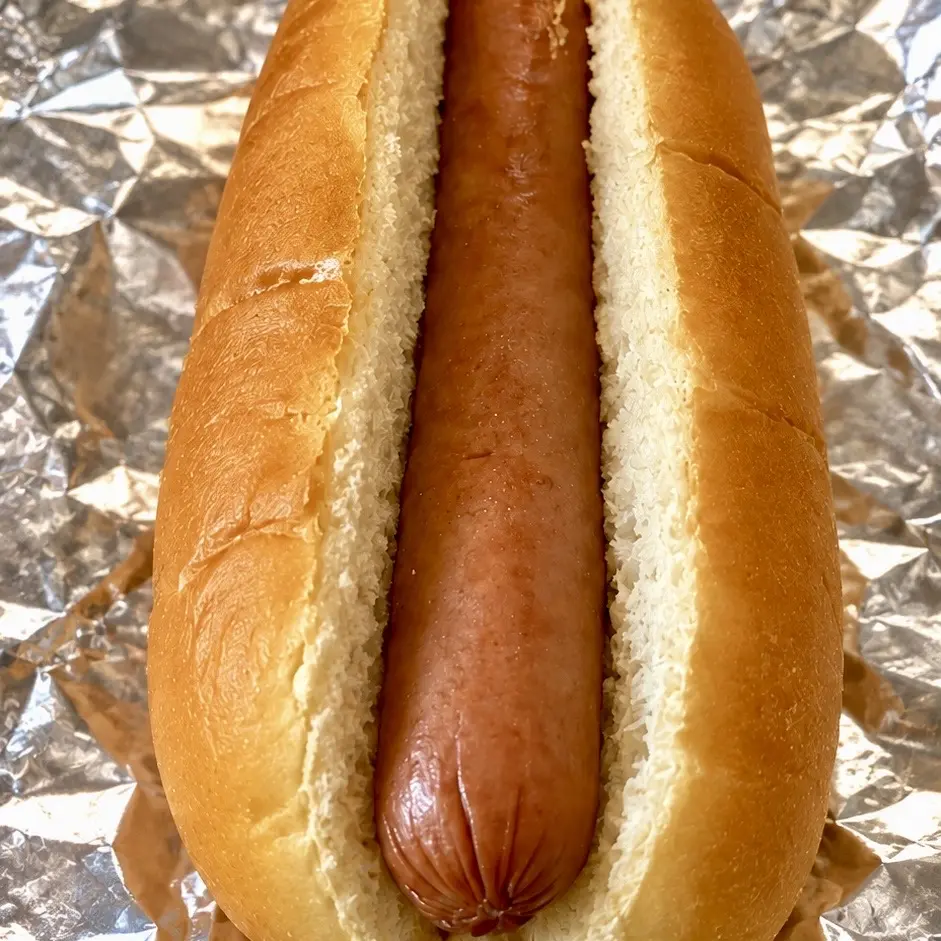 Actual Plain Jain plain hot dog served on aluminum foil